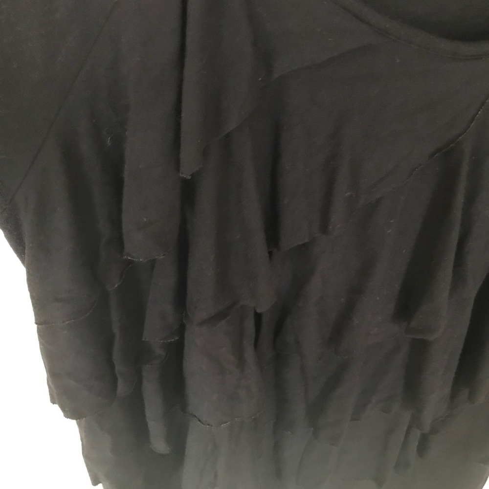 Black 3/4 sleeve with ruffles on front.